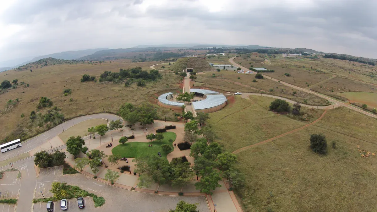 The Maropeng Visitor Centre, its grass-covered burial-mound building rising above the Cradle of Humankind grassland