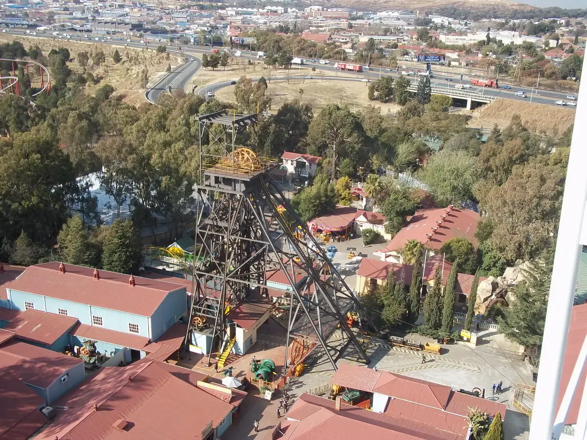 The Gold Reef City mine headgear seen from the Big Wheel, with the park's rides below it